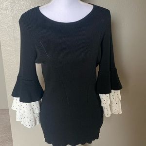 DESIGN HISTORY Women’s Ruffle Sleeve Sweater, black with polka dot bell sleeves